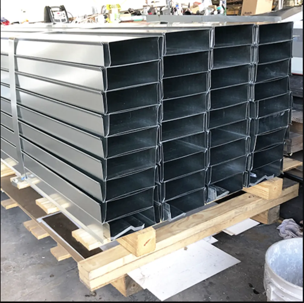 Stacked dark parapet coping and coping cap parts prepared for packaging