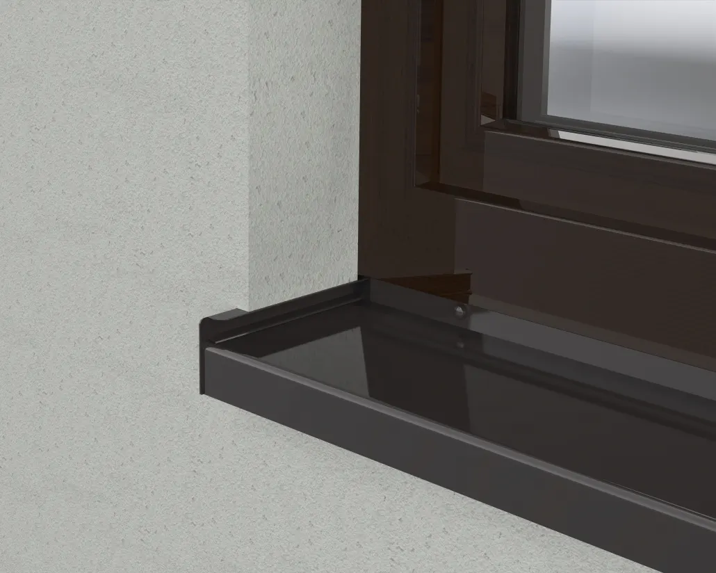 Installed dark metal sill pan detail at the base of a commercial window opening