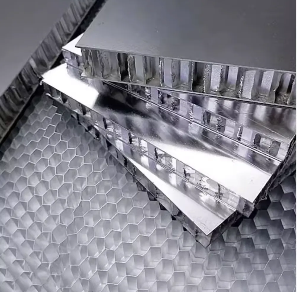 Close-up of metallic interior closure panel sections with a honeycomb-style core