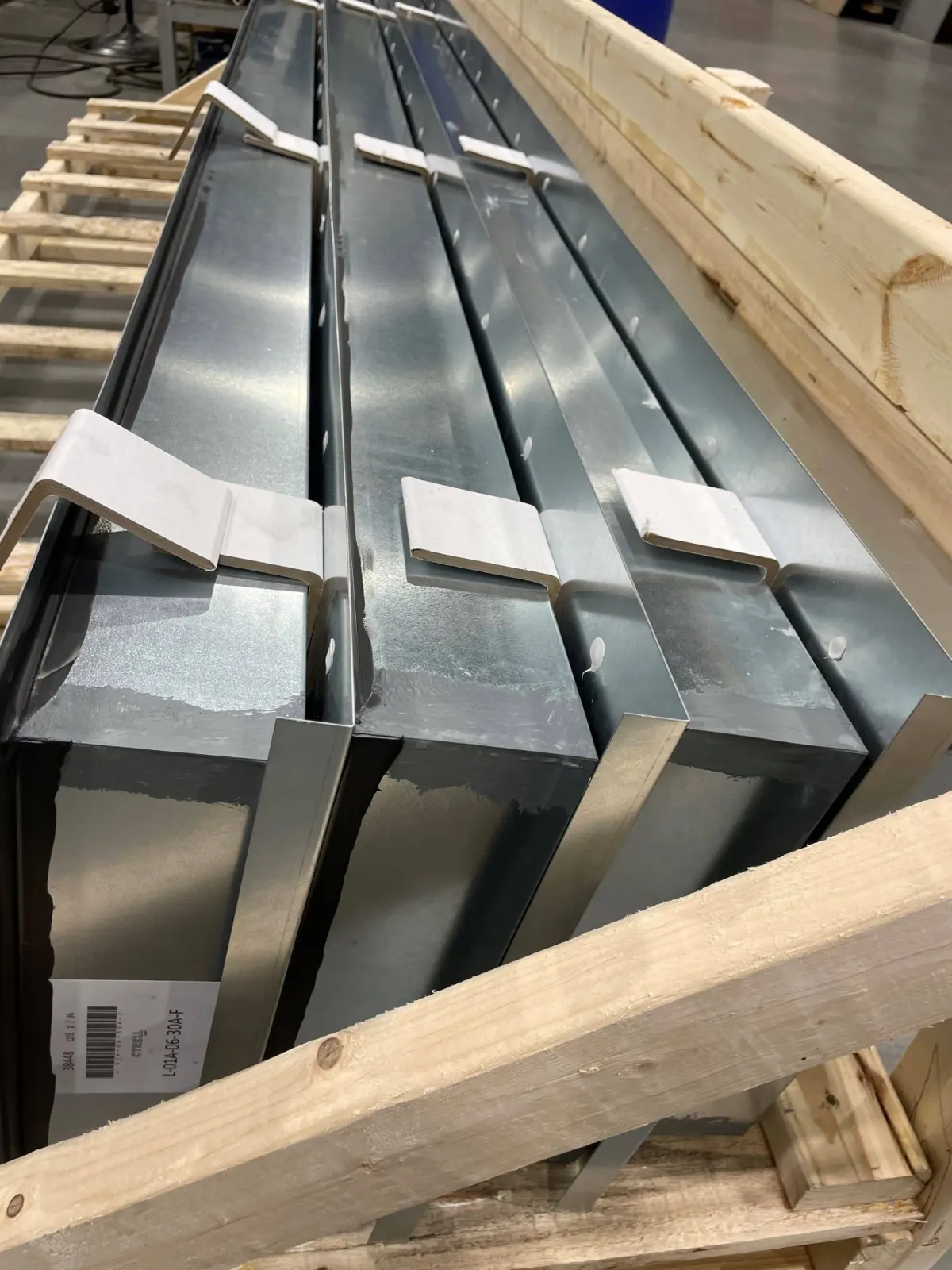 Crated shadow-box style fabricated panel assemblies prepared for shipment