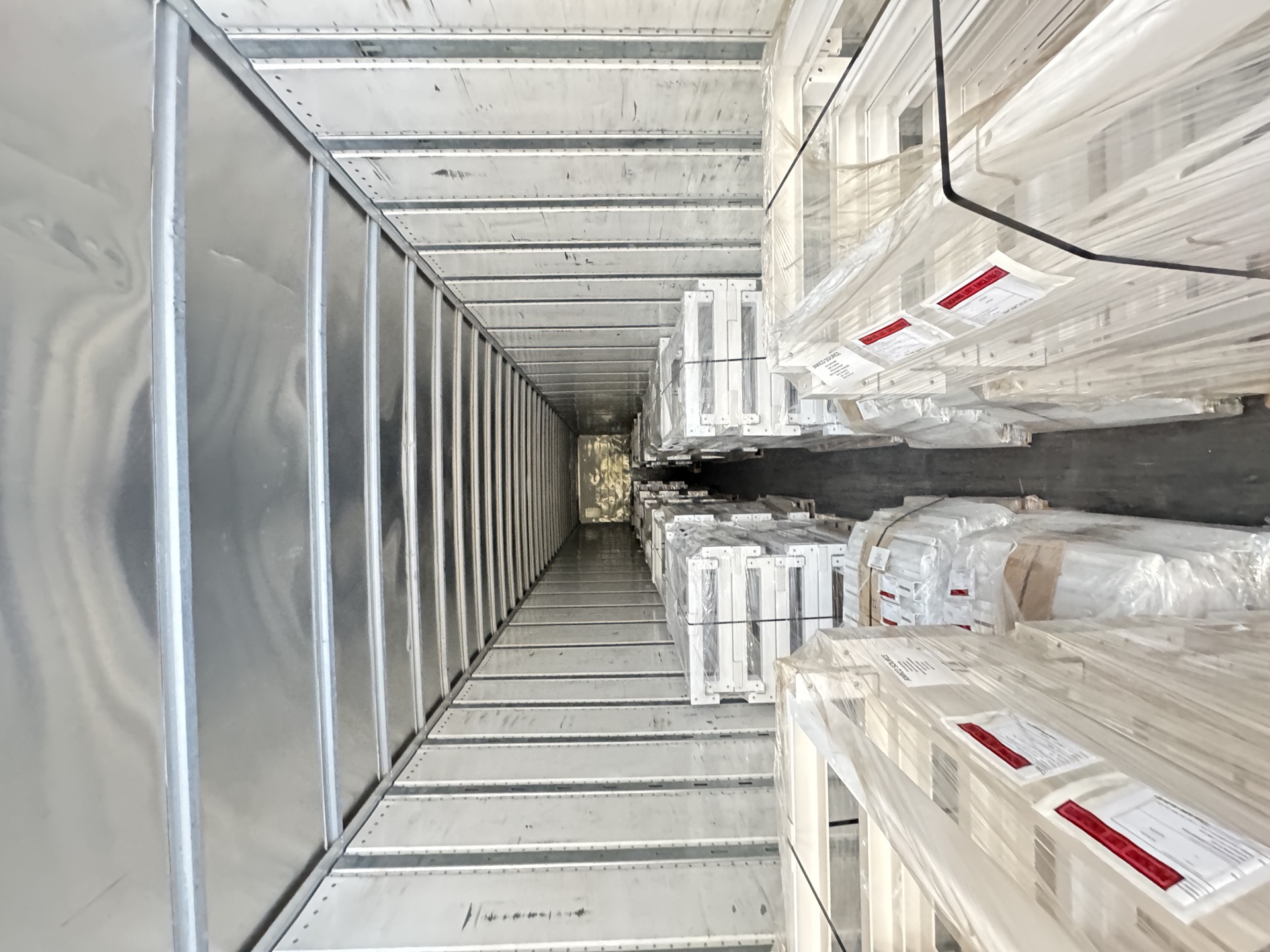 Finished and packaged metal parts loaded for delivery