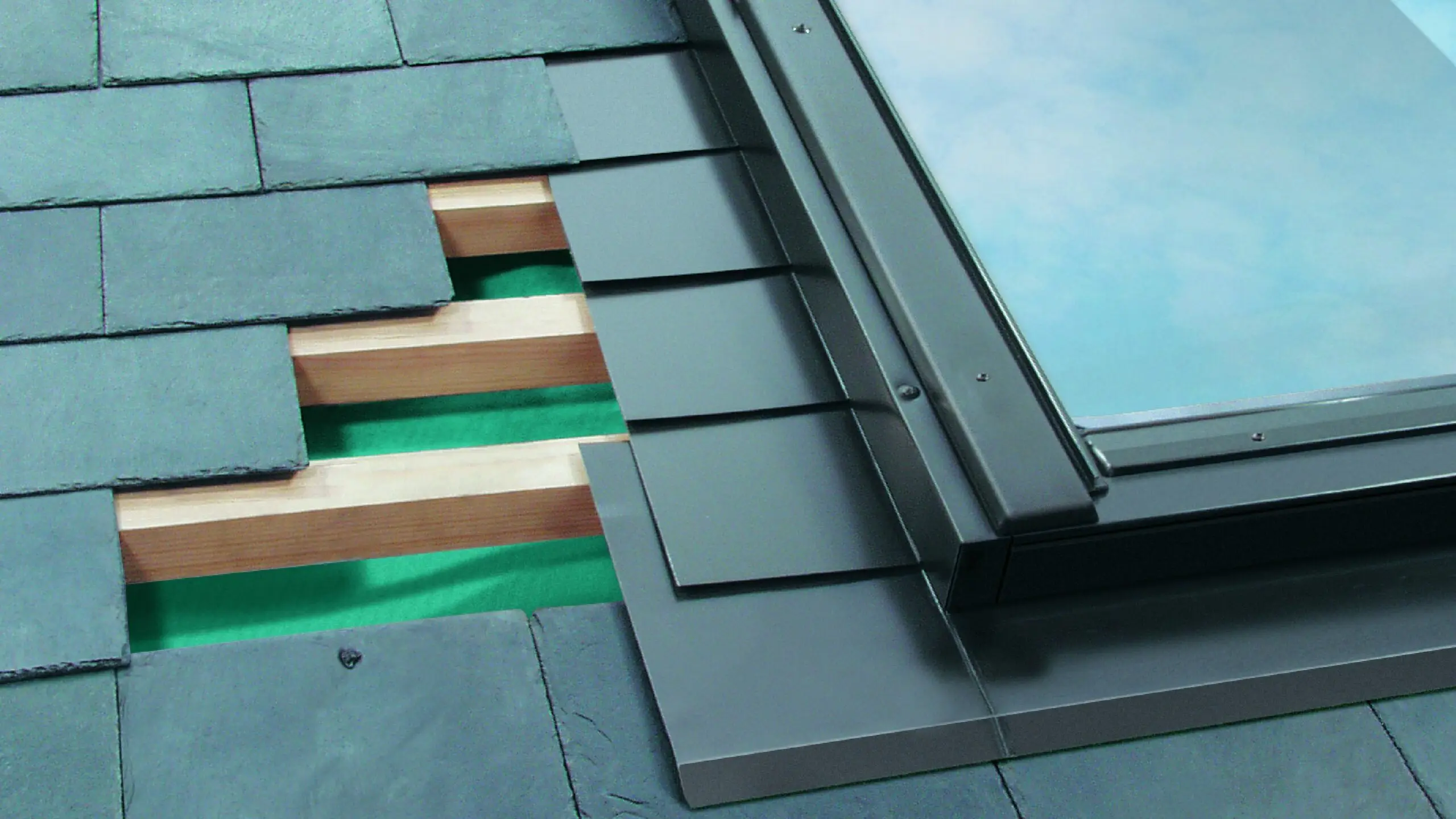 Roof flashing assembled around a skylight showing layered trim and waterproofing conditions.